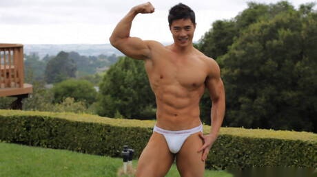 Oriental bull Peter Le undressing and showing tight butt outdoor