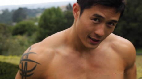 Oriental bull Peter Le undressing and showing tight butt outdoor