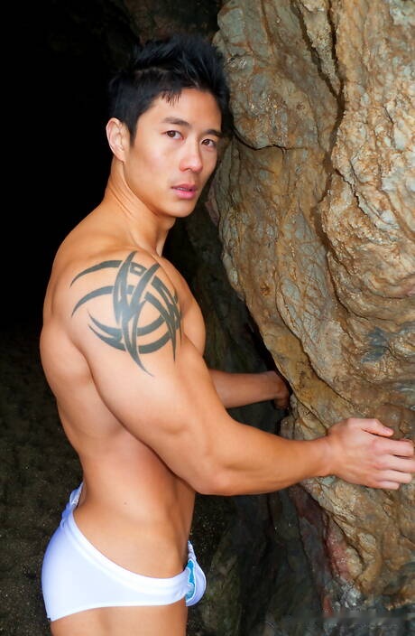 Oriental bull Peter Le shows a well-build body after beach