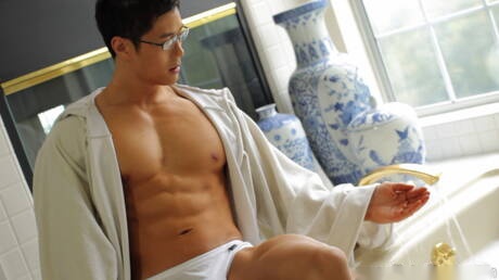 Asian bodybuilder Peter Le masturbating in bathroom
