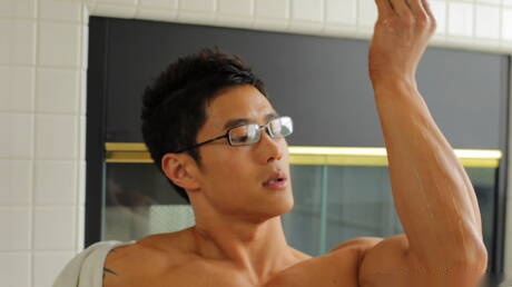 Asian bodybuilder Peter Le masturbating in bathroom