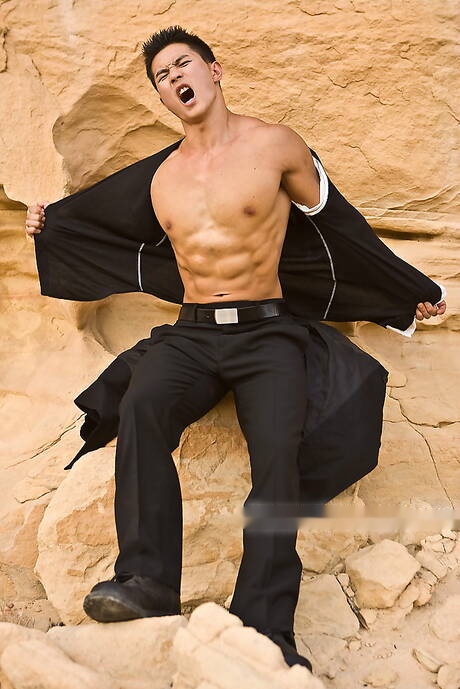 Asian strong bull Peter Le shows a strong body outdoor