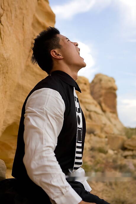 Oriental strong bull Peter Le take off his clothes outdoor