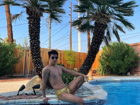 Oriental hot twink Levy Foxx jerking with sex toy in the pool