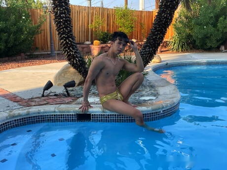 Oriental hot twink Levy Foxx jerking with sex toy in the pool