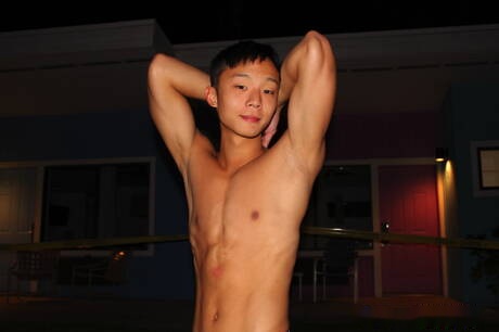 Oriental young dude Dane Jaxson masturbating with dildo at pool