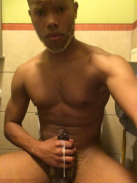 Ebony strongman Timarrie Baker jerk off his cock in bathroom