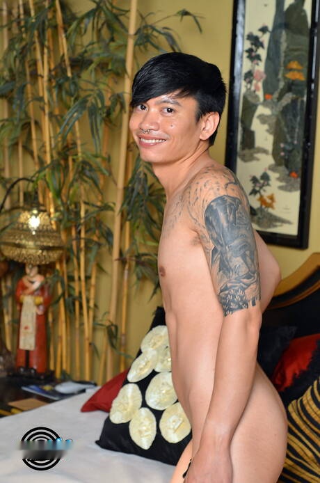 Oriental young dude Khoi Aka Chonna get naked and showing tight ass outside