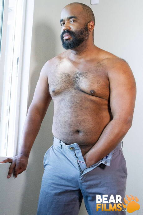 Black hot bear Emmett Frost take off his clothes