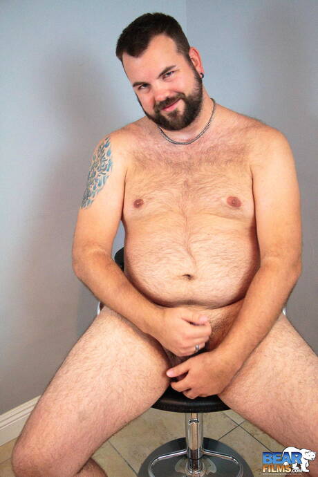 American hot bear Aiden Storm posing naked and showing his ass
