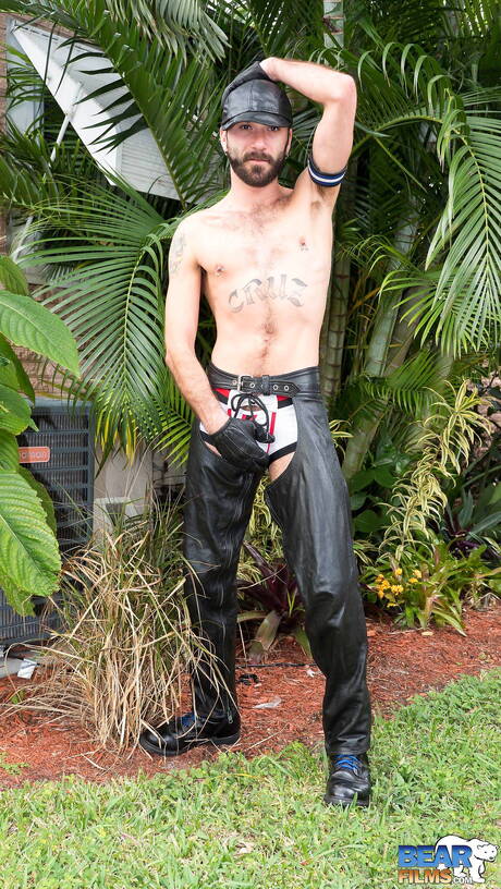 Hunky guy Ethan Palmer posing nude outside