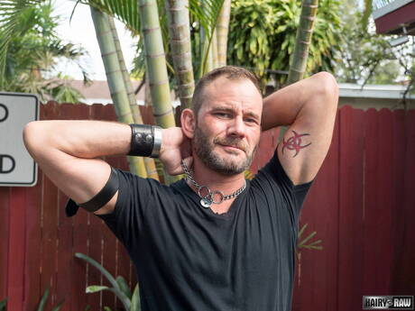 Bear Bruce Bacch posing nude and showing his butt outside