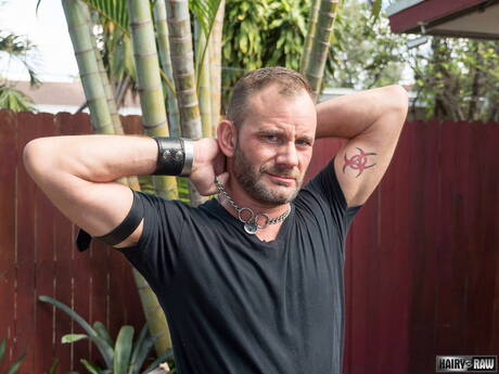 Bear Bruce Bacch posing nude and showing his butt outside