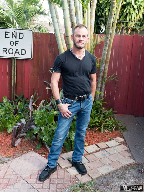 Bear Bruce Bacch posing nude and showing his butt outside