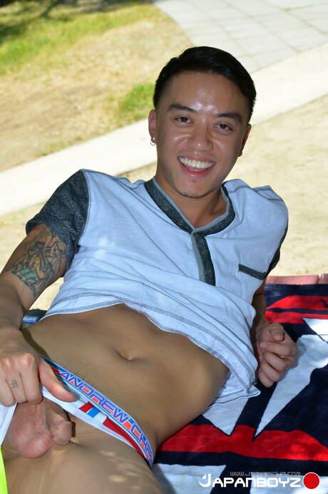 Asian hunk Coda Filthy get naked and showing his ass outdoor