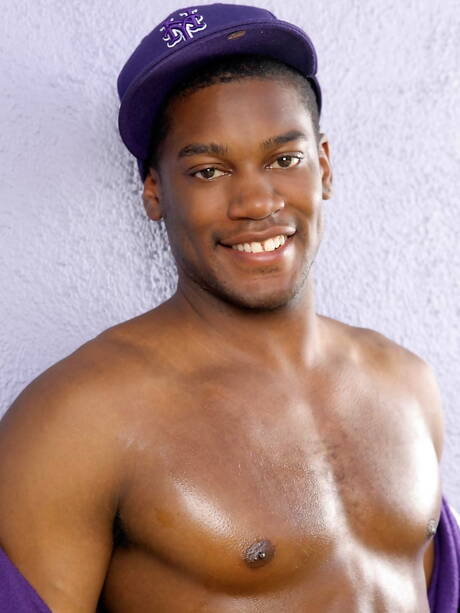 Ebony bull Kevin Colfax undressing and showing tight ass outside