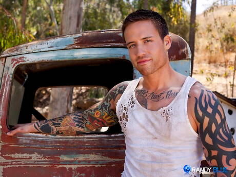 American beefcake Jordan Levine teasing his dick outside