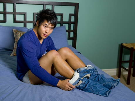Asian hunk Tai Lee teasing his cock