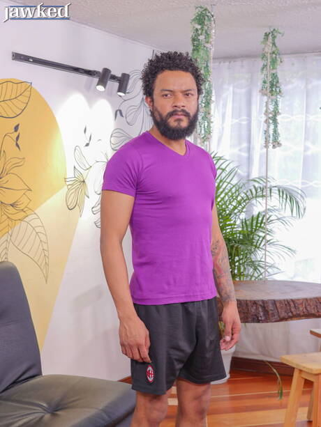 Ebony hunk Ego Red undressing and showing tight butt