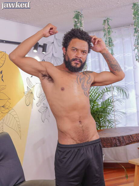 Ebony hunk Ego Red undressing and showing tight butt