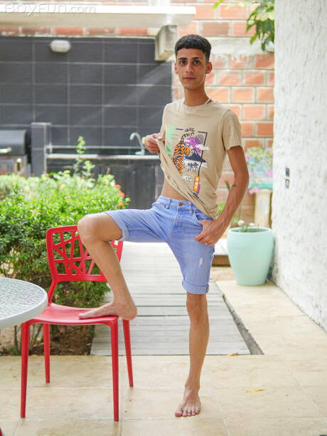 Latino young boy Axel Turner get naked and showing hot butt outside