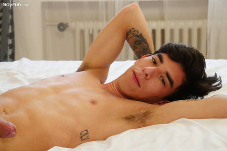 Latino young Roman Capellini undressing and showing tight butt