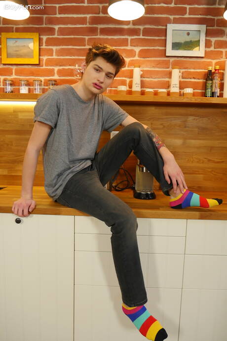 Young dude Curtis Cameron posing nude in kitchen