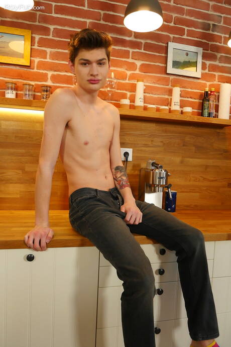 Young dude Curtis Cameron posing nude in kitchen