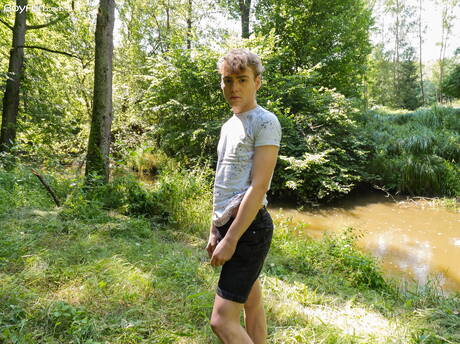 Beautiful boy Lucian Fair posing nude and showing his ass outside