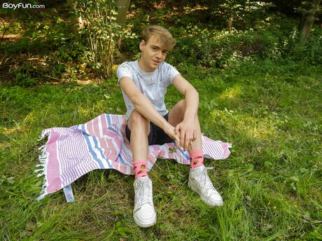 Beautiful boy Lucian Fair posing nude and showing his ass outside