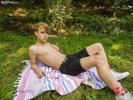 Beautiful boy Lucian Fair posing nude and showing his ass outside