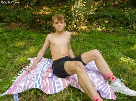 Beautiful boy Lucian Fair posing nude and showing his ass outside