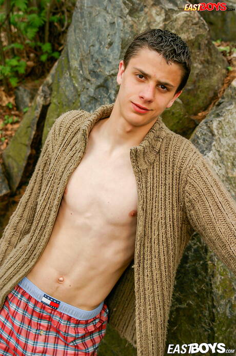 Young boy Eliah get naked and showing tight ass outside