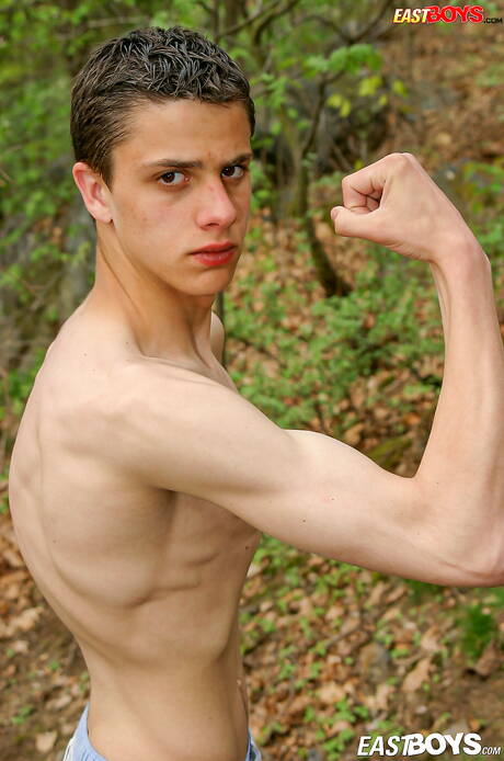 Young boy Eliah get naked and showing tight ass outside