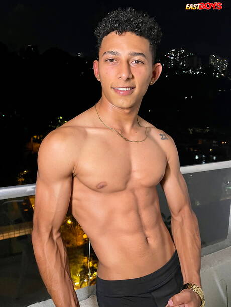 Latino bull Marcus Brown shows a perfect body outdoor