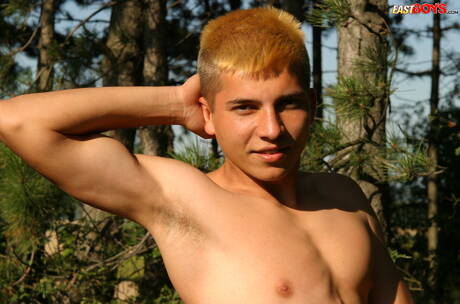 Young dude Milos posing nude and showing tight butt outside