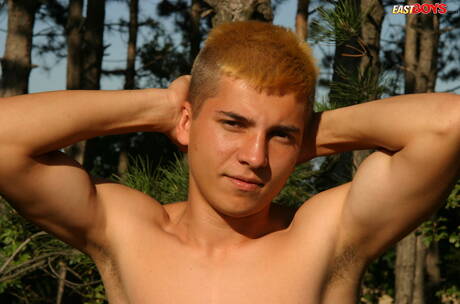 Young dude Milos posing nude and showing tight butt outside