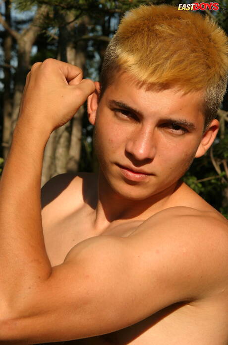 Young dude Milos posing nude and showing tight butt outside