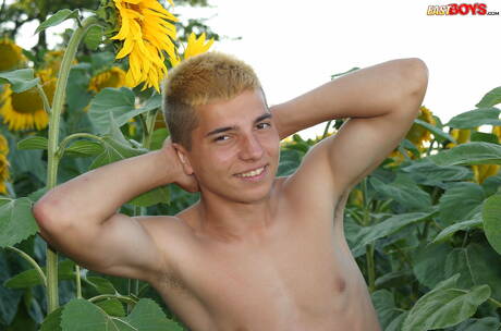 Young dude Milos posing nude and showing tight butt outside