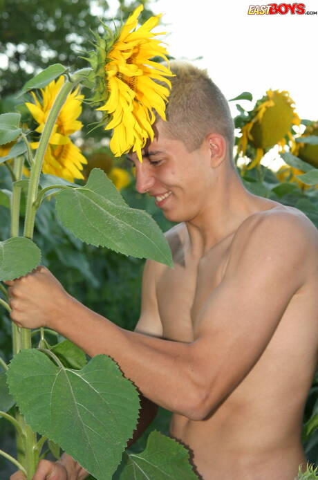 Young dude Milos posing nude and showing tight butt outside