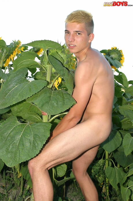 Young dude Milos posing nude and showing tight butt outside