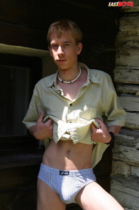 Young boy Kelly shows a beautiful body outdoor