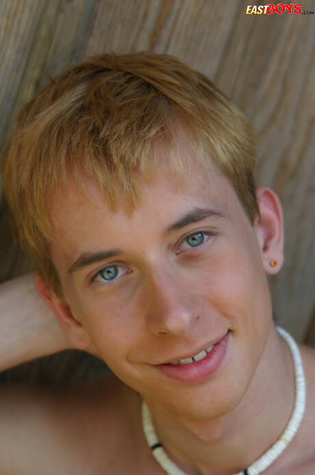 Young boy Kelly shows a beautiful body outdoor