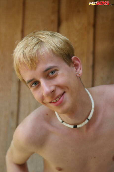 Young boy Kelly shows a beautiful body outdoor