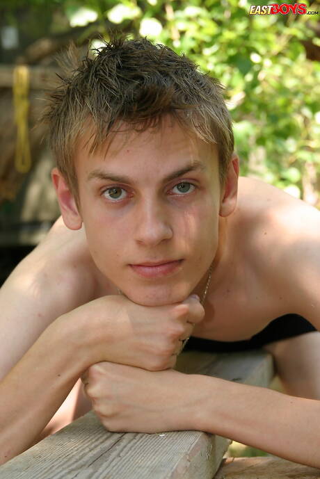 Young boy Oto shows a perfect body outside