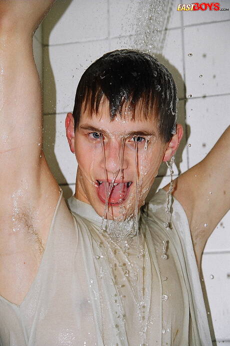 Twink Robbie undressing and showing nice ass in shower