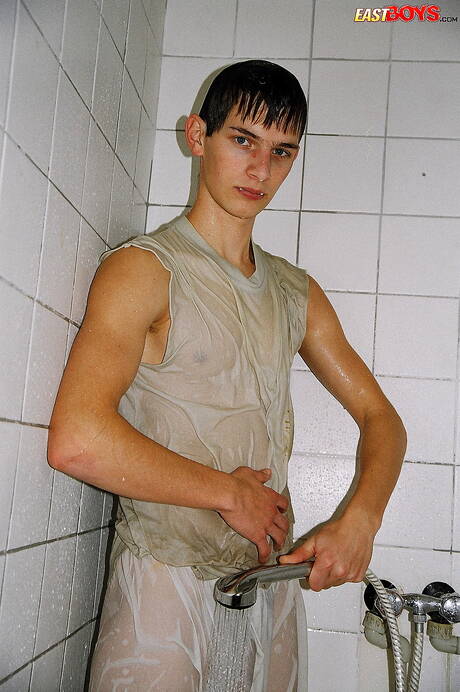 Twink Robbie undressing and showing nice ass in shower