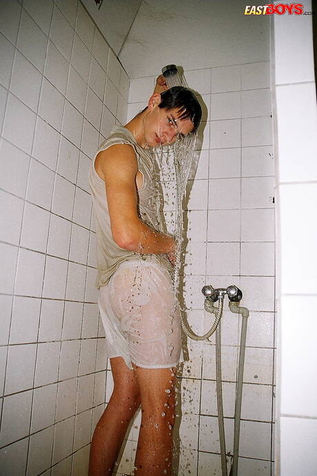 Twink Robbie undressing and showing nice ass in shower