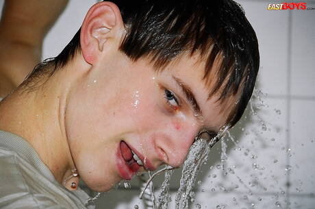 Twink Robbie undressing and showing nice ass in shower