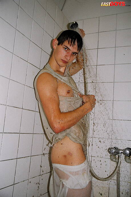 Twink Robbie undressing and showing nice ass in shower